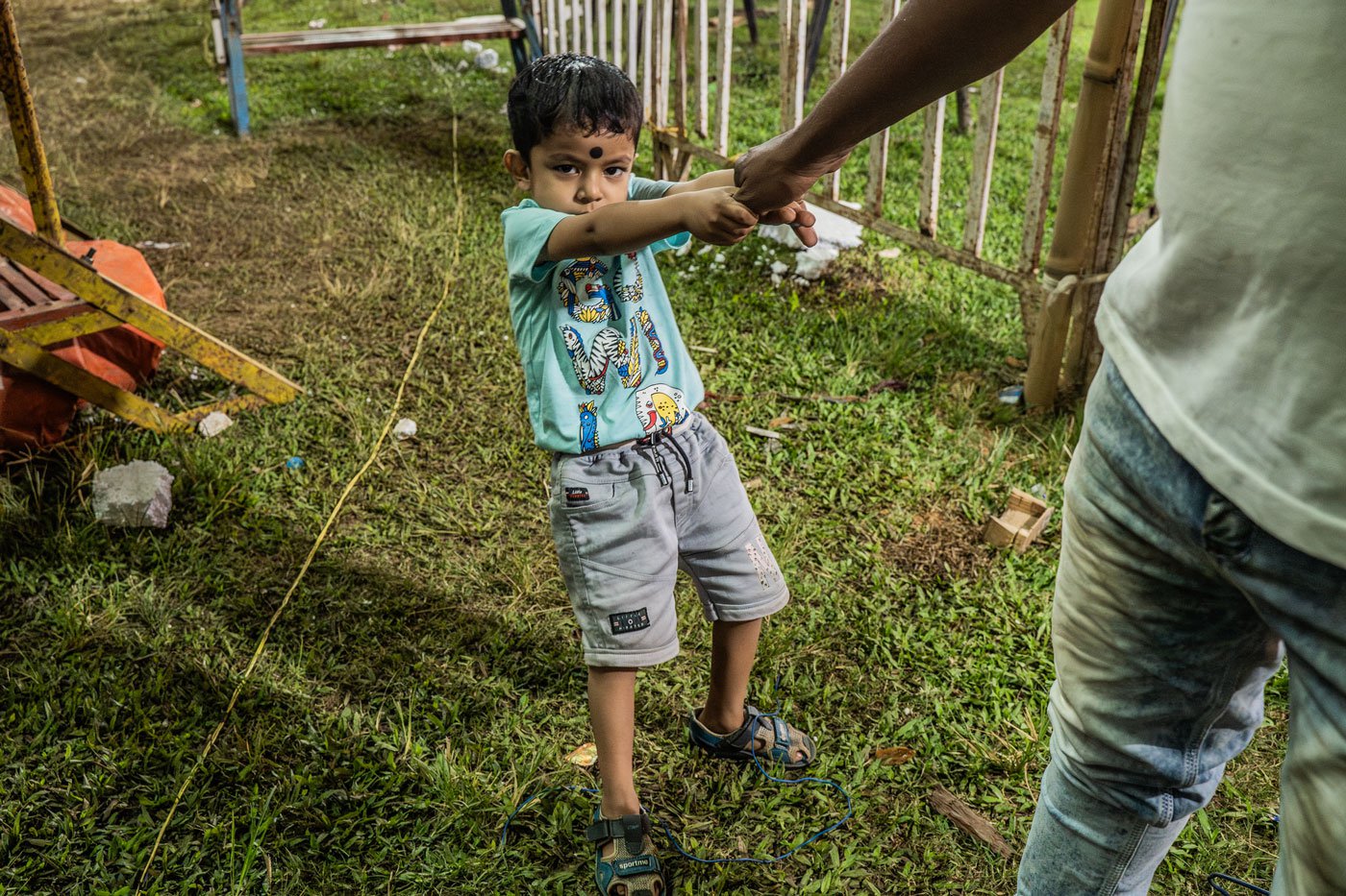 Rubel Sheikh plays with his son after an act. Usually, the riders take a break of 15-20 mins between two acts. They perform at least 30 times in one night