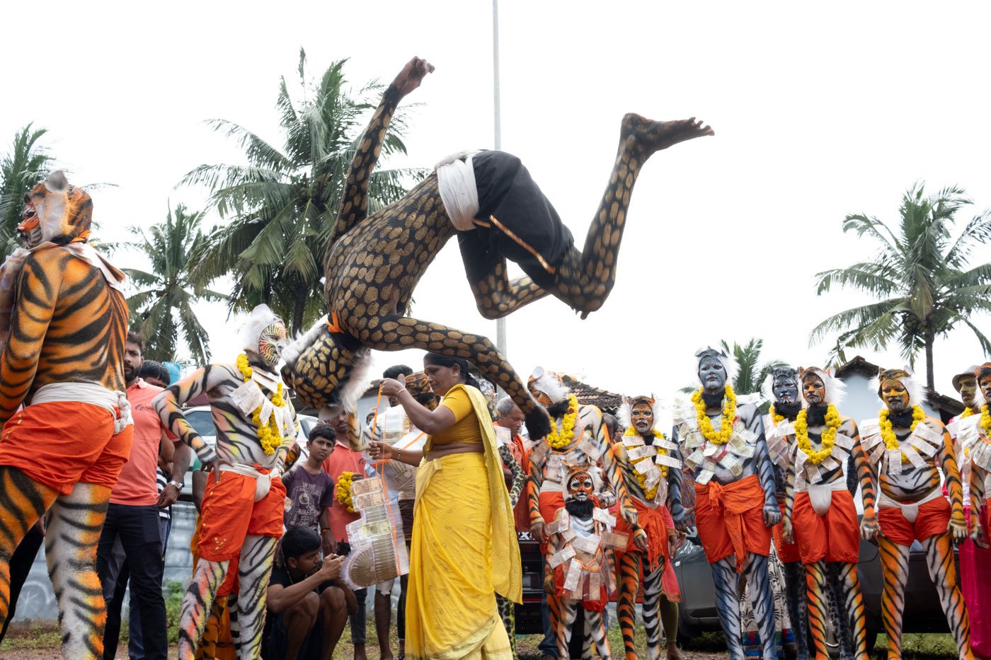 The stunts in this performance include forward and reverse flips, breaking coconuts with one’s head, fire breathing and more