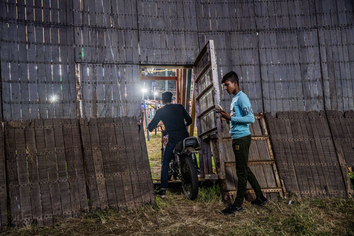 Pankaj Kumar rides out of a small gate at the end of a performance