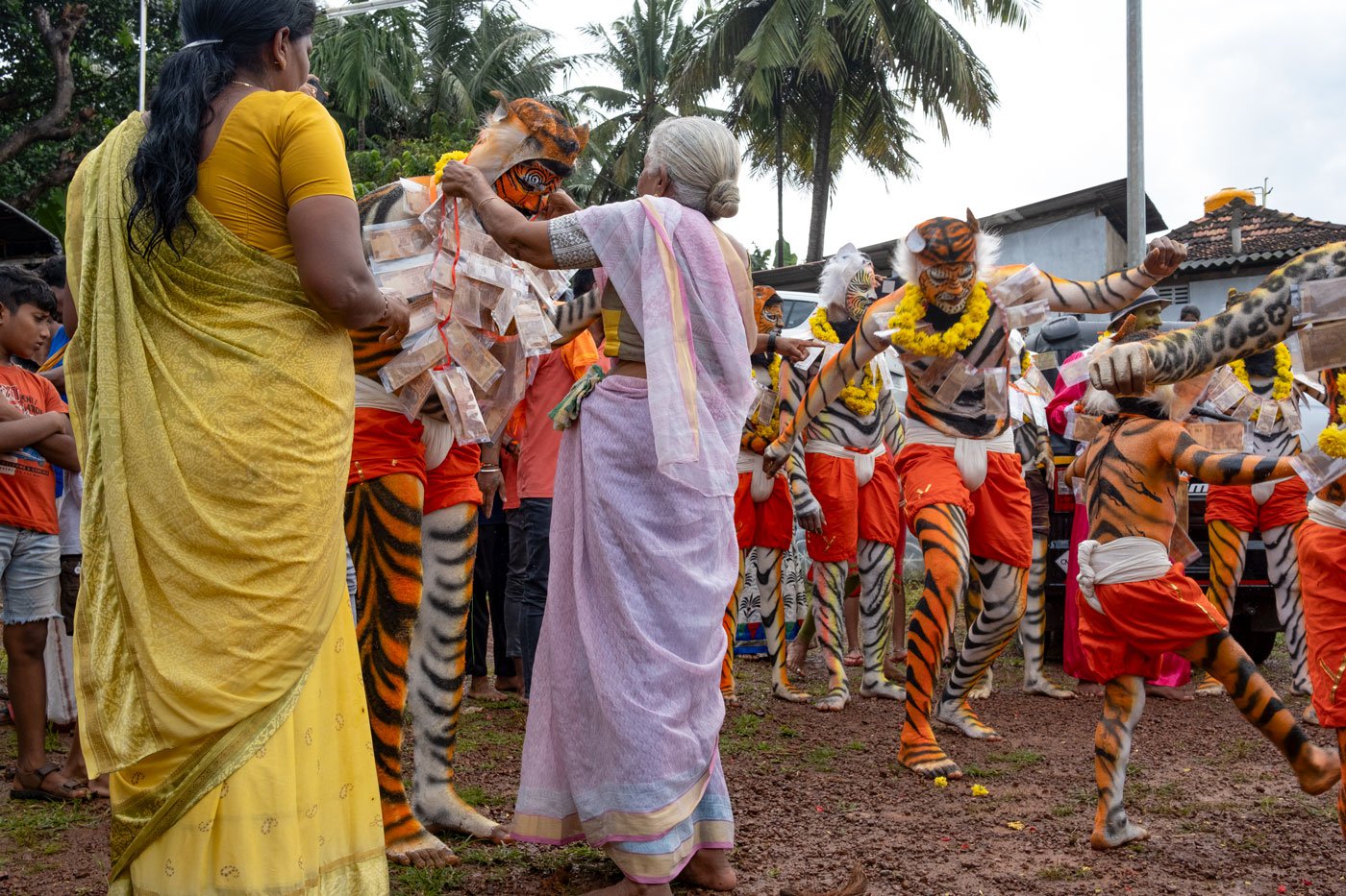 Sandesh's grandmother, Kamala Shetty and mother, Vijaya Shetty, cheering him as he performs pili vesha . Sandesh is a photographer and painter. 'Since the last four years I have started performing pili vesha and will continue performing in the future too,' says the 21-year-old