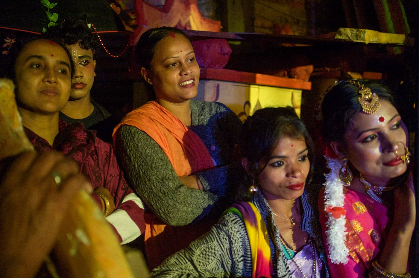 Actors and audience members enjoy the performances from the wings