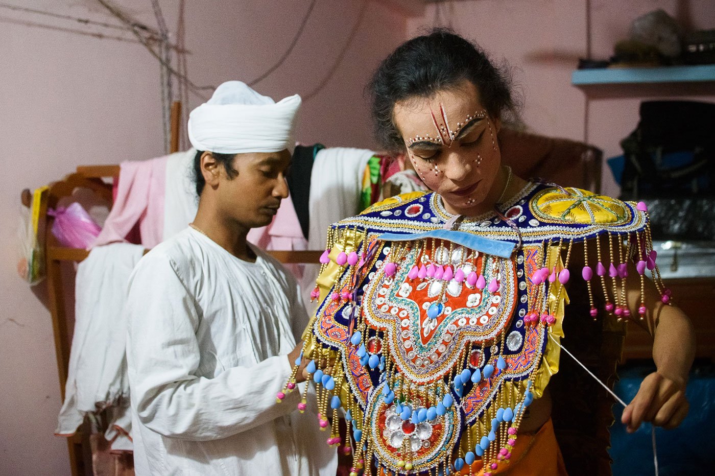 Niranjan Saikia (left) and Krishna Jodumoni Saika (right) – monks from the Uttar Kamalabari Satra – in their boha (quarters). Getting into costumes is an elaborate process