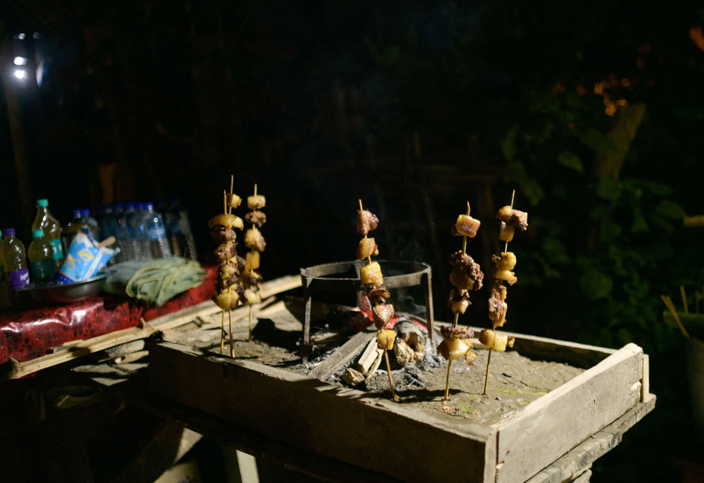 Roasted pork and apong , a traditional rice beer made by the Mising community, are popular fare at the Borun Chitadar Chuk mahotsav