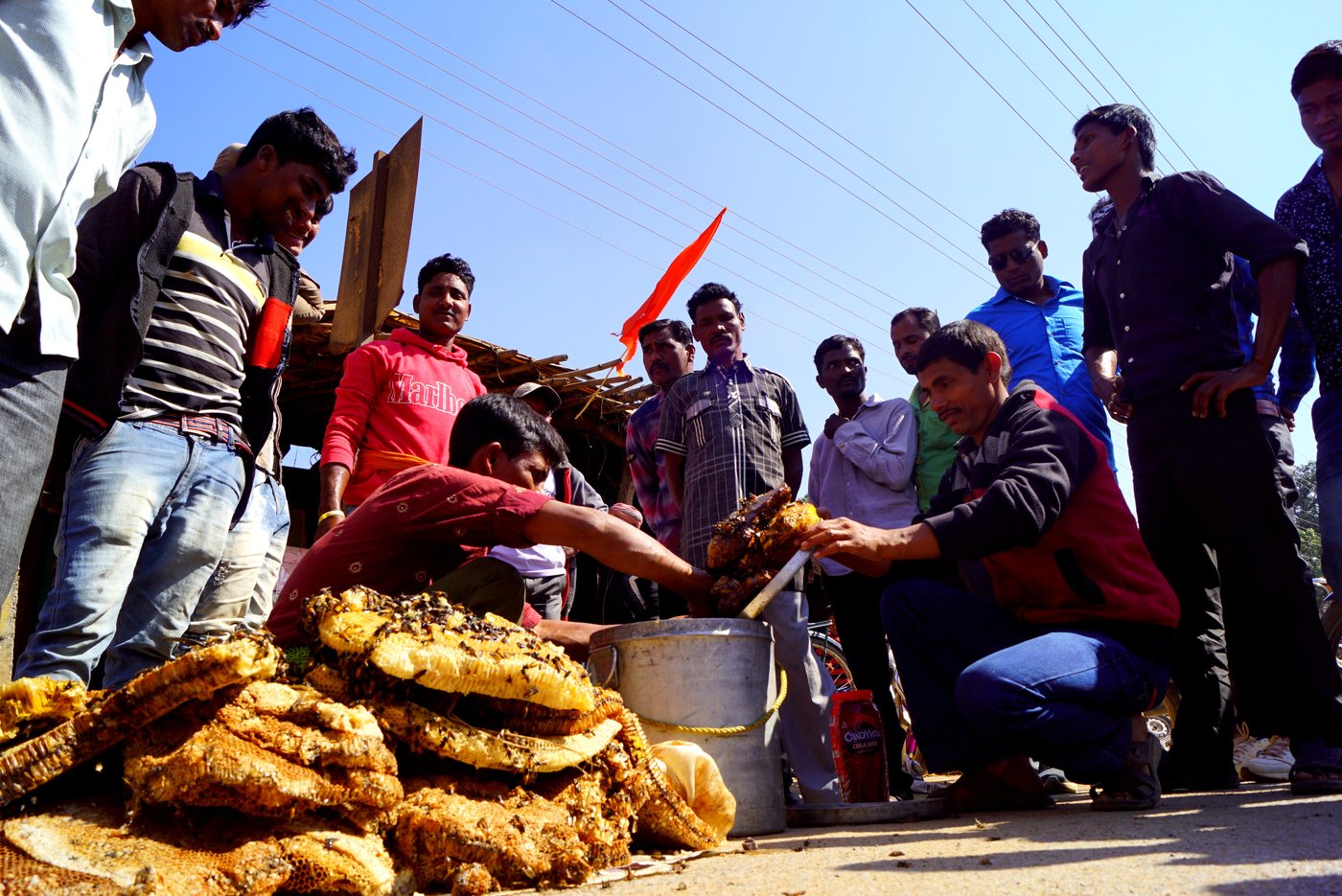 people selling honey in the market