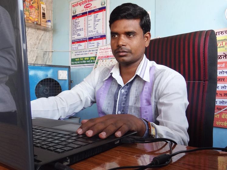 Rama Matte at his office desk working.