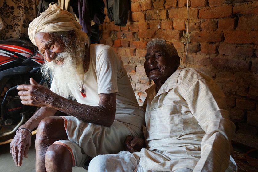 Left: Lokkhi Mahato sharing a lighter moment with his dearest friend, Thelu Mahato in Pirra village of West Bengal, in February 2022.