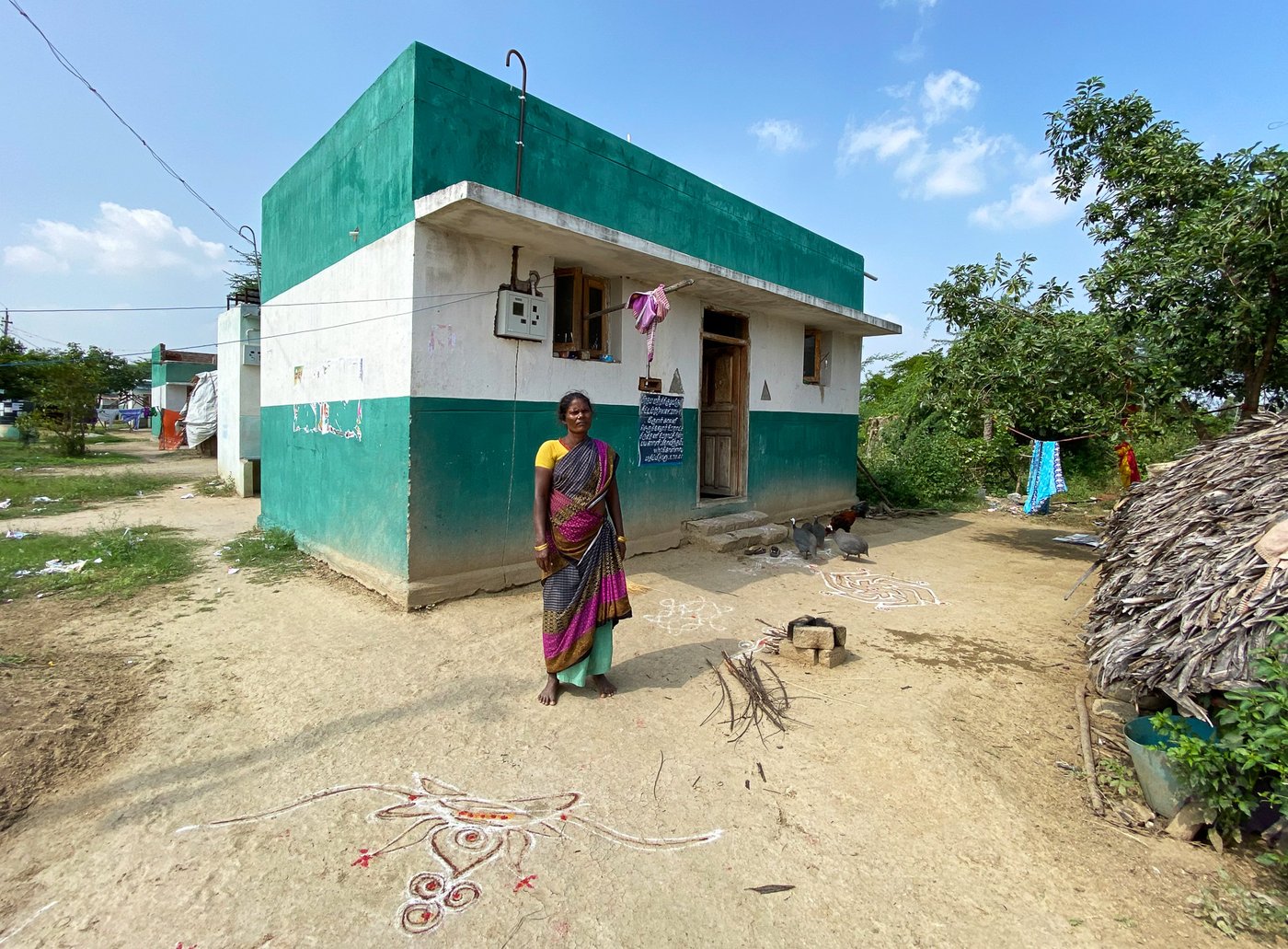 At times, the wages the Irula women count on withdrawing from their accounts fall short, as it did for K. Govindammal (left) when she constructed a house under the Pradhan Mantri Awas Yojana, and has been the experience of other women too in this small hamlet of Irulas (right)
