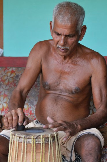 Left: The men of a family work together at home. Right: Applying the black paste on a drumhead requires precision