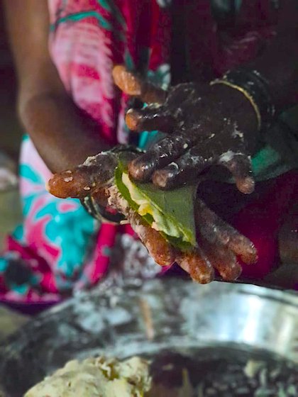 The delicious pandmodi is made from a dough of rice from our fields, grated cucumbur and jaggery, placed between a folded chai leaf and steamed 