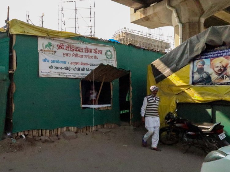 The free health clinic (left) that was set up for  farmers camping at the Tikri border site. Dr. Sakshi Pannu (in the pink dress) ran it every day since April