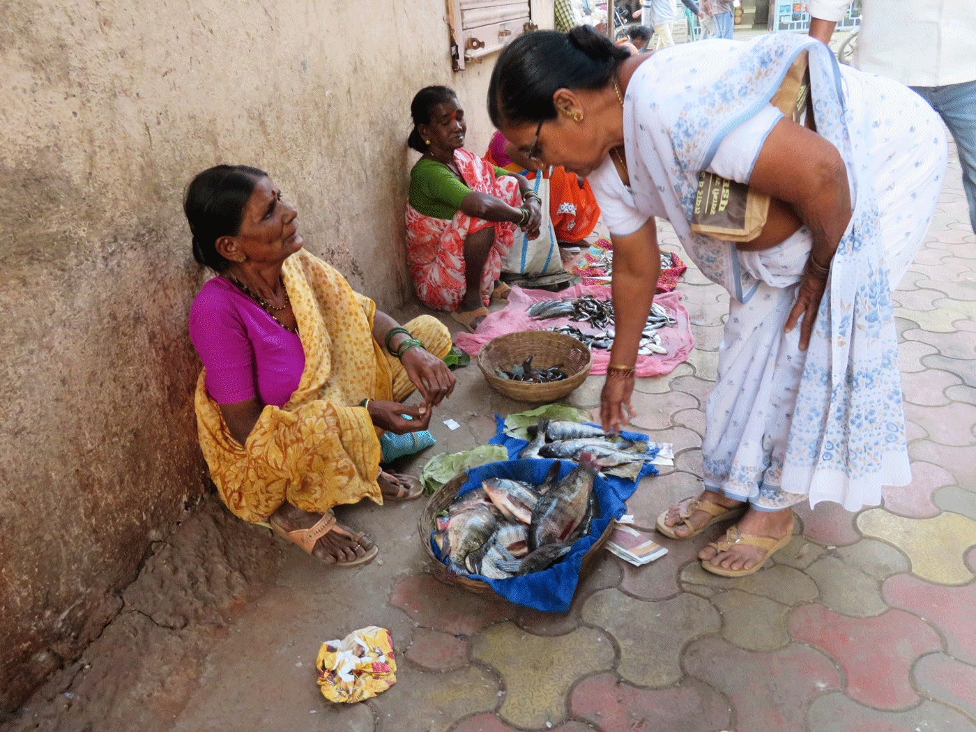 Old lady selling fishes