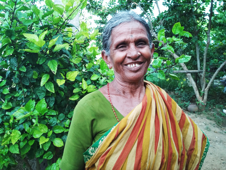 Village elder R. Dhanalakshmi smiling 