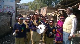 Bringing them to school singing and drumming