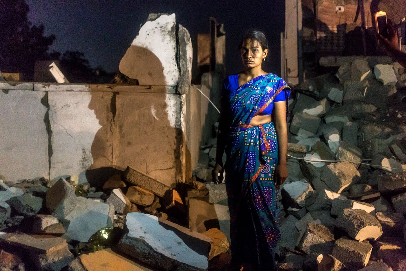 S. Parveen next to the house she and her husband built last year