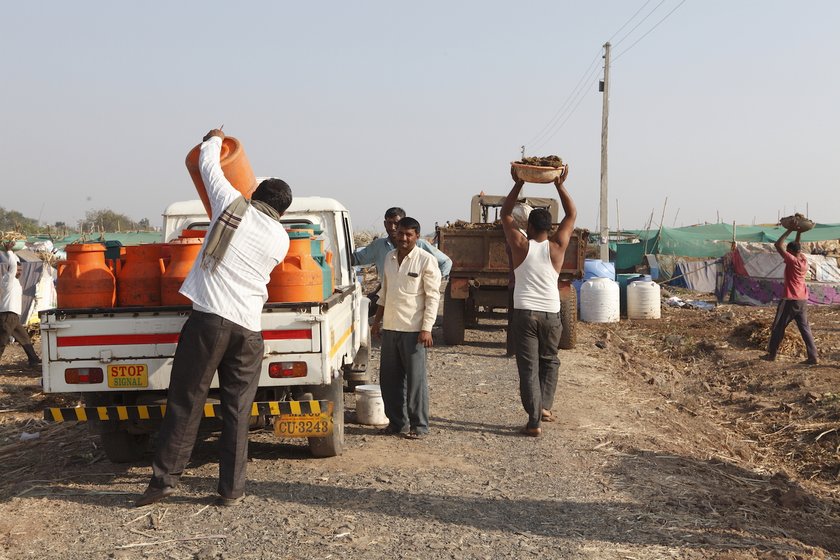 Men transport milk and fodder