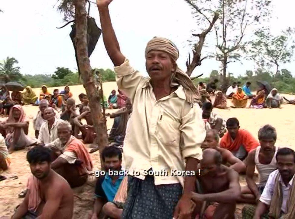 Man singing amongst group of people